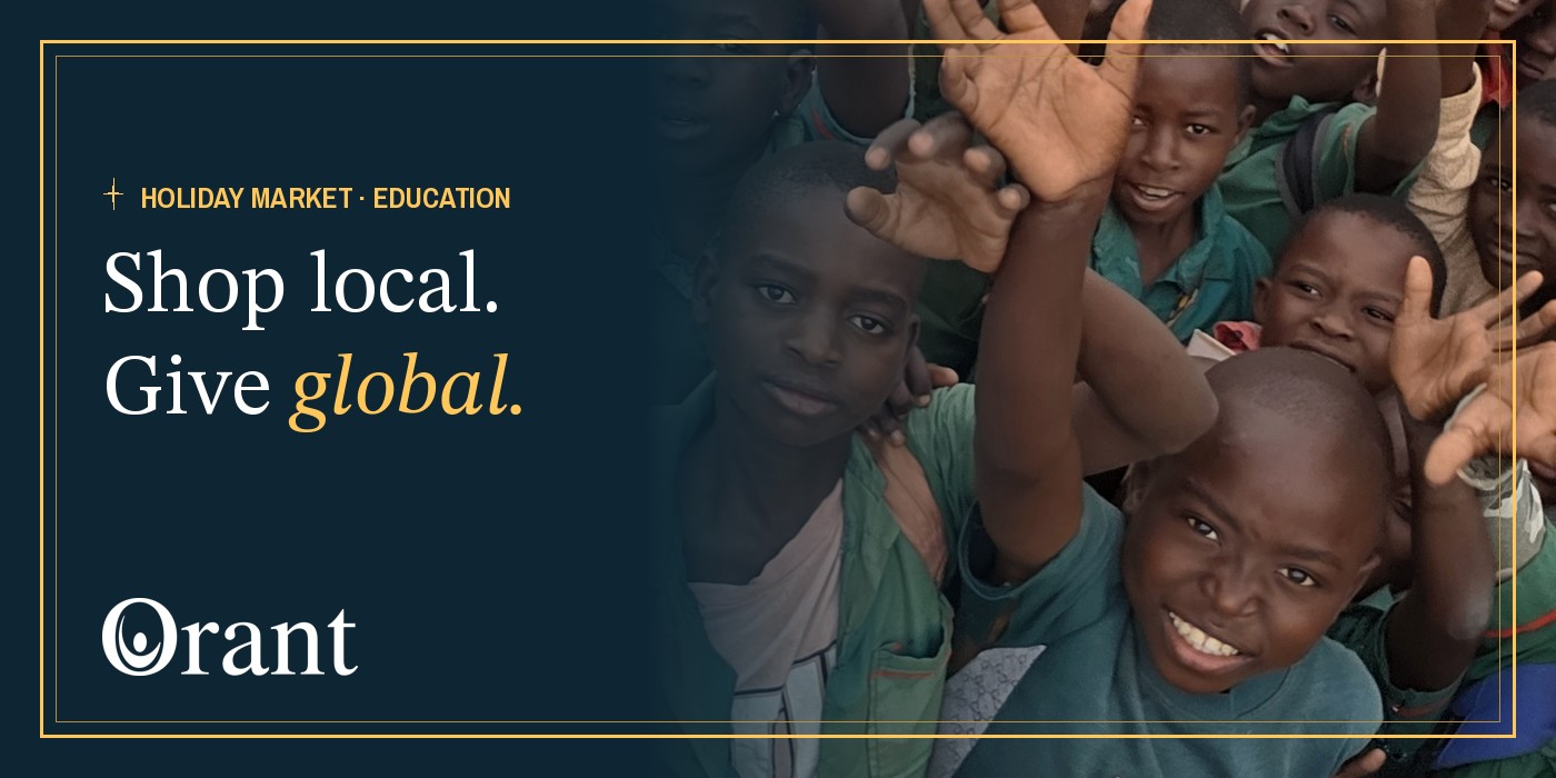 Students at a primary school near Kasese, Malawi, smile and wave at the camera. Shop local. Give global.