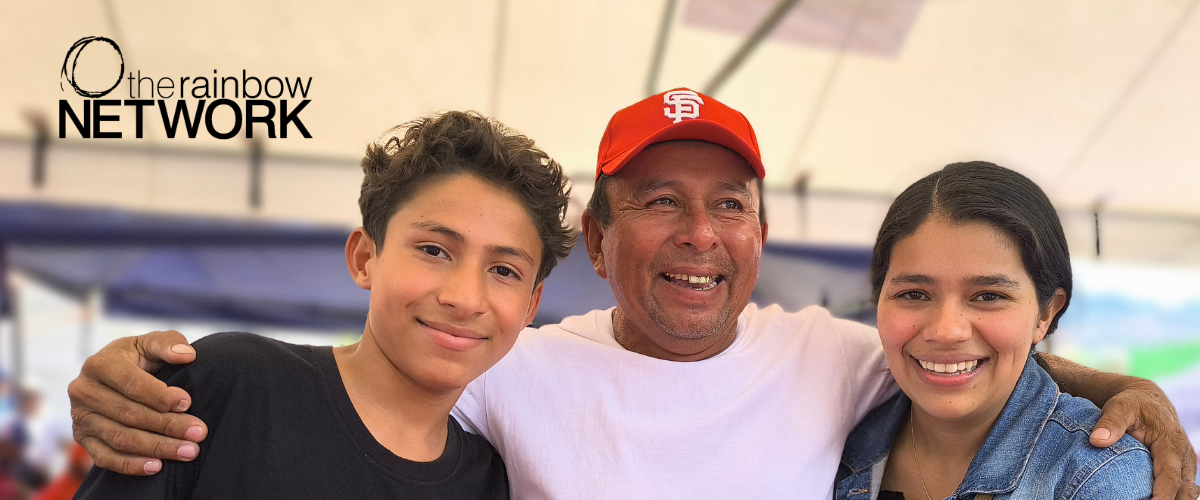 Three children holding notebooks