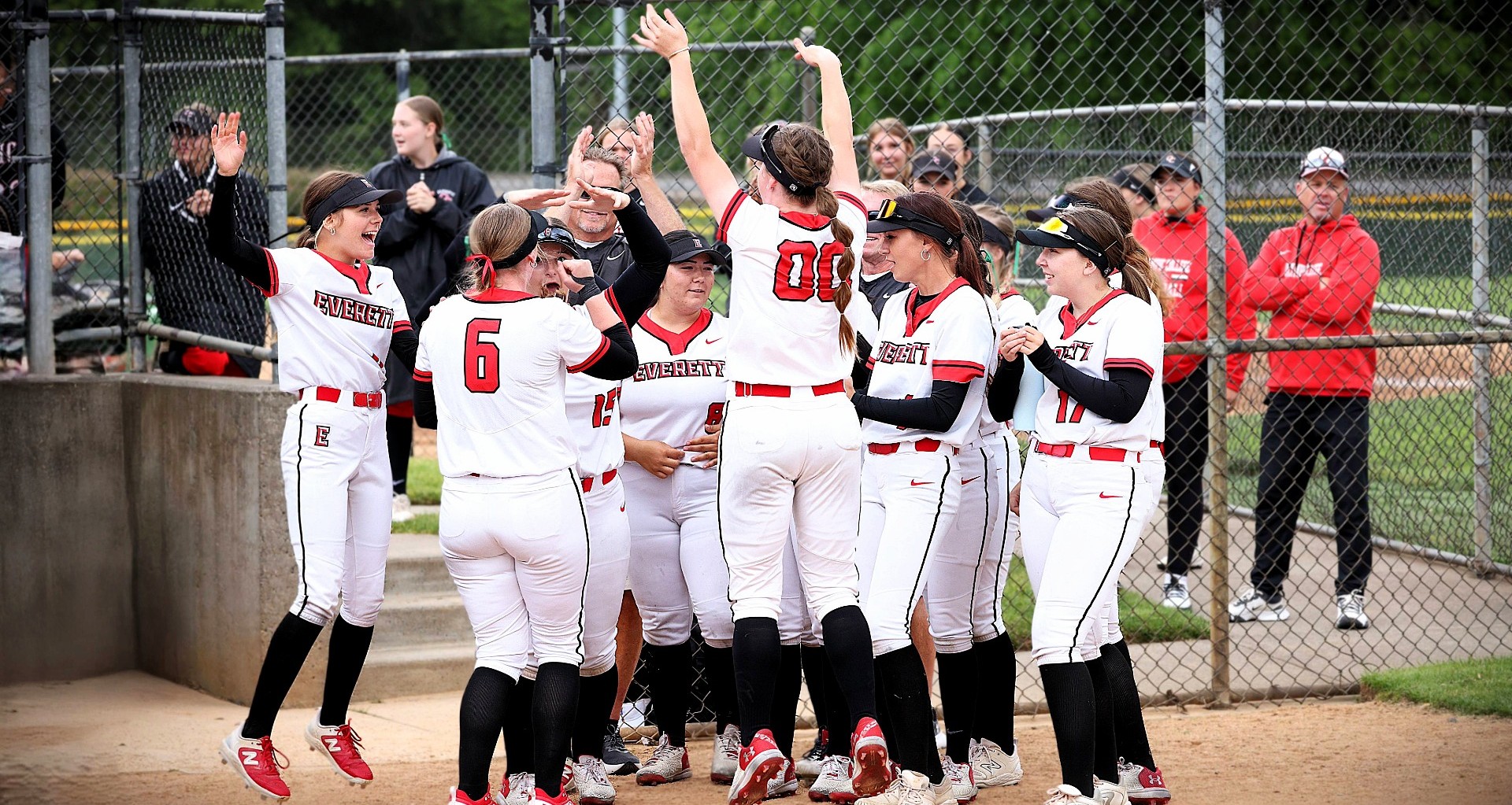 Womens softball team celebrating at the NWAC Championship 2025